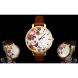 Olivia Burton 'English Garden' Tan And Gold Tone Watch Statement watch with oversized dial,