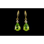 Peridot and White Topaz Drop Earrings, pear cut solitaires of the brilliant green peridot,