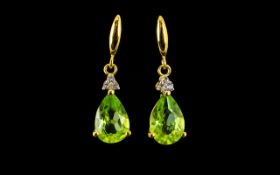 Peridot and White Topaz Drop Earrings, pear cut solitaires of the brilliant green peridot,