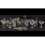 A Mixed Collection Of Drinking Glasses Mostly wine and liqueur to include two amethyst glass wine