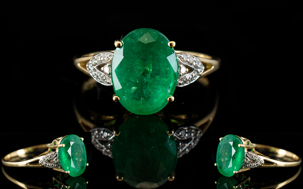 18ct Gold - Faceted Oval Shaped Emerald and Diamond Set Dress Ring,