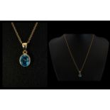 A Faceted Blue Topaz 9ct Gold Set Pendant The bale marked for 9ct gold, strung on yellow metal