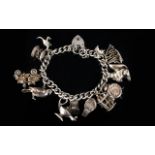 Solid Silver Curb Bracelet Loaded with 11 Nice Quality Silver Charms,