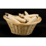 Good quality large oval wicker basket containing 20 or more flying shuttle loom bobbins measuring