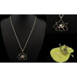 Vivienne Westwood Pendant Necklace White metal flower pendant with attached chain,