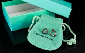 Tiffany & Co Pair Of Silver Heart Shaped Earrings Stud earrings in the form of open hearts,