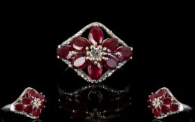 Ruby Flower Lozenge Shape Ring, eight oval cut rubies, of good, strong colour,