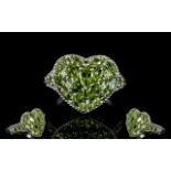 Peridot Heart Shape Cluster Ring, a pear cut peridot set slightly above a cluster of marquise and