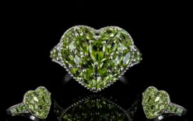 Peridot Heart Shape Cluster Ring, a pear cut peridot set slightly above a cluster of marquise and