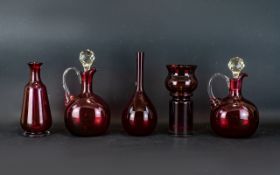 A Collection Of Five Early - Mid 20th Century Ruby Coloured Glass Vessels To include two decanters,