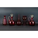 A Collection Of Five Early - Mid 20th Century Ruby Coloured Glass Vessels To include two decanters,