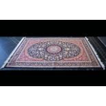 A Large Woven Silk Carpet Keshan rug with cobalt blue ground and traditional Middle Eastern floral