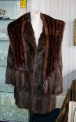 Attractive Mink Coat Dark Brown, three quarter length with revere collar and slit pockets.