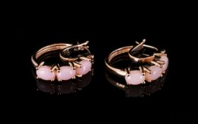 Pink Opal Hoop Earrings, the hoops each set with three oval cut pink opal cabochons to the front,