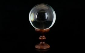 Antique Glass Spherical Ball Together With A Wooden Stand. Overall Height 4.5 Inches.