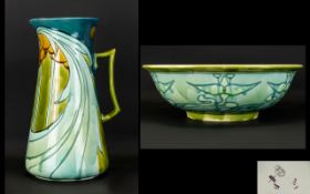 A Minton Secessionist Wash Jug And Bowl. The Jug, Circa 1905, tubelined and decorated with