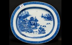 A 19th Century Oriental Oval Charger Large blue and white charger depicting pagodas and