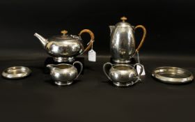 Liberty & Co Tudric Pewter Six-Piece Tea Service Planished finish with wicker wound handles,