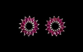 Ruby Marquise Cut Circle Earrings, a flared circle of marquise cut rubies spreading from an open