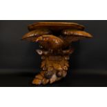 A 1920's Golden Oak Clock Bracket Modelled In The Form Of An Eagle With Outstretched Wings,