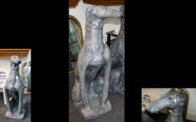 A Large Resin Figure In The Form Of A Greyhound floor standing figure of seated greyhound finished