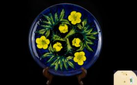 Moorcroft Modern Tubelined Limited Edition Cabinet Plate 'Buttercups' design on blue ground.