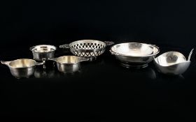 A Collection Of Silver Salts And Porringers To include two twin handle salts,