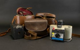 A Small Collection Of Binoculars And Cameras To include Polaroid Swinger II Land Camera, Kodak No.