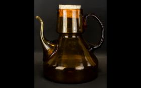 A Rare Victorian Amber Glass Wine Carafe Of Unusually Large Proportion,