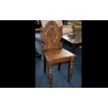 Oak Hall Chair - early 20th century carved back chair of small proportions and curlicue back.