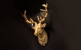 Contemporary Gilt Resin Wall Mounted Stags Head Statement wall hanging in the form of a hunting