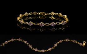 9ct Gold Gemset Bracelet Lozenge form links, each set with four faceted pale purple gemstones.