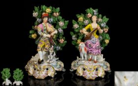 A Pair Of Late 19th Century Chelsea Style Bocage Musician Figures Each in polychrome enamel,