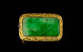 Antique Yellow Metal Jadeite Stone Brooch Set with a rectangular jadeite panel,