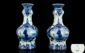 Pair of Delft Vases each one 6.5" high, blue and white with beautiful designs. Marked V & B No.