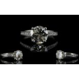 Ladies Platinum Set Attractive Single Stone Diamond Ring Set with Diamond Shoulders.