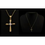 A 14ct Gold Diamond Set Cross with Attached 14ct Gold Chain and Cross 2.7 grams.