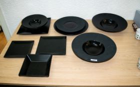 Collection of Black Tableware Pieces to include one large round plate 12" diameter,