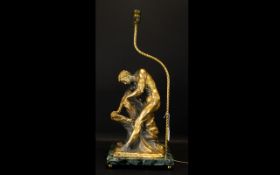 A Cast Metal Figural Lamp Base Raised on verde marble base,