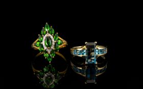 Two Contemporary 9ct Gold Gem Set Dress Rings The first set with blue topaz,