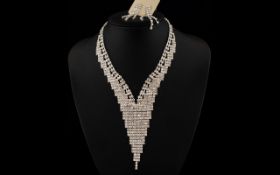 White Crystal Deep V Necklace and Earrings, an articulated 'sheet' of closely set,