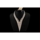 White Crystal Deep V Necklace and Earrings, an articulated 'sheet' of closely set,