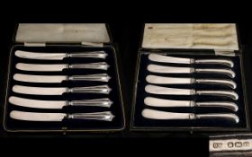 Two Sets Of Silver Handle Butter Knives Each in fitted cases,