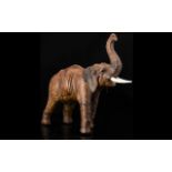 Antique Leather Model Of An Elephant, Realistically Modelled, trunk up.