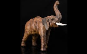 Antique Leather Model Of An Elephant, Realistically Modelled, trunk up.