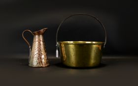A Large Brass Jam Pan Of typical form, together with a small copper jug with embossed reptile