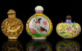 A Collection Of Three Oriental Snuff Bottles To include cloisonne floral decorated bottle,