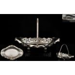 A Nice Quality Solid Silver Swing Handle Fruit Basket with Open worked Sides, Raised on Ball Feet.