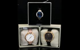 A Collection Of Three Fashion Watches Each in boxed,