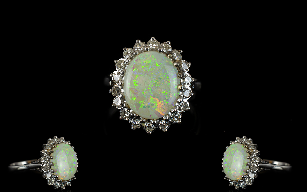 Ladies 18ct White Gold Opal & Diamond Set Cluster Ring appealing flower head design marked 18ct.